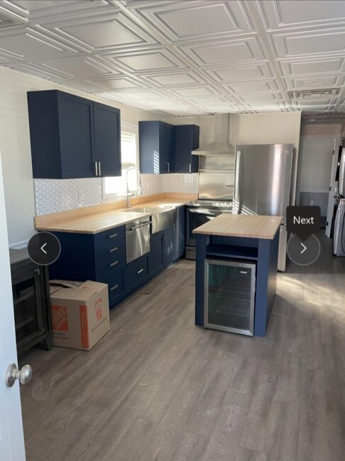 kitchen area with island in commercial building for sale - Tool Push housing